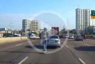 Guy on Rented Scooter Crosses 5 Highway Lanes Wearing Headphones