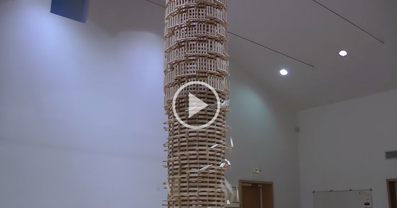 Toppling a Giant Domino Tower 2 Stories High