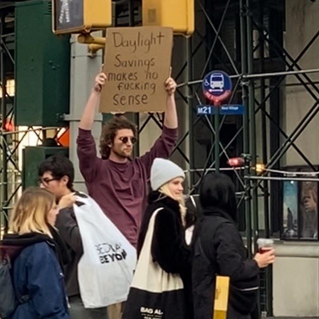 Dude with Sign Protests the Most Random Things (13 Photos) - TwistedSifter