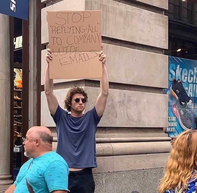 Dude with Sign Protests the Most Random Things (13 Photos) - TwistedSifter