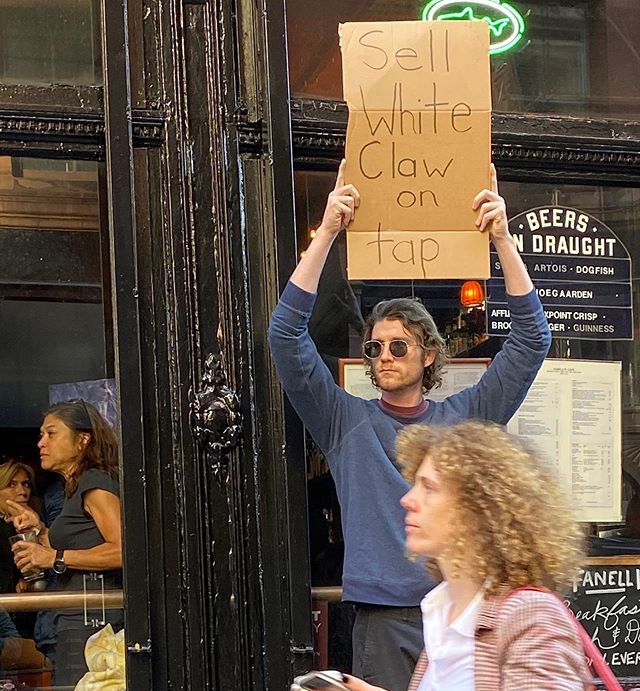 Dude with Sign Protests the Most Random Things (13 Photos) - TwistedSifter