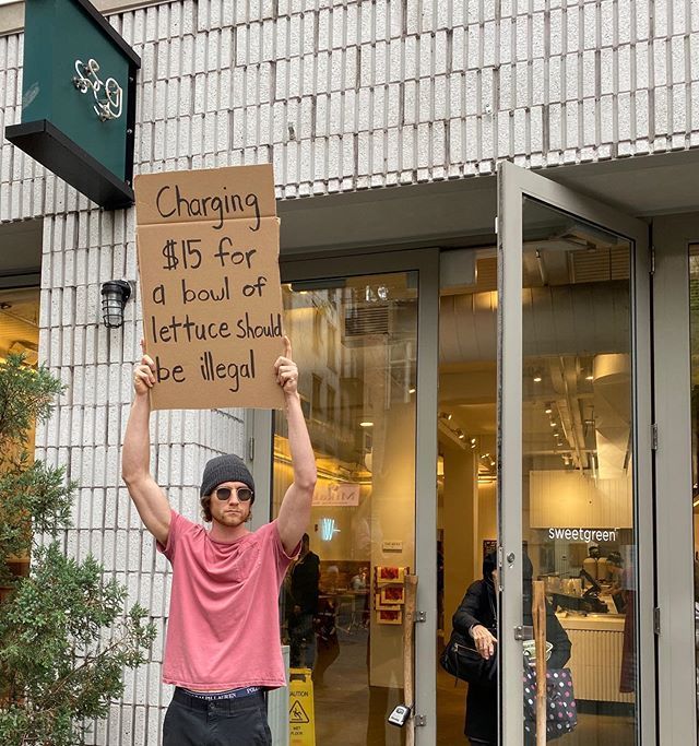 Dude with Sign Protests the Most Random Things (13 Photos) - TwistedSifter