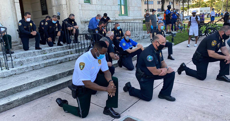 Across the Country, a Few Brave Police Officers are Standing in Solidarity