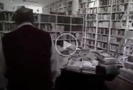 Umberto Eco Looking for a Book in His Massive Library
