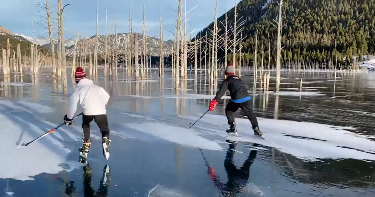 Two Kids Play Hockey On Montana's Frozen Quake Lake