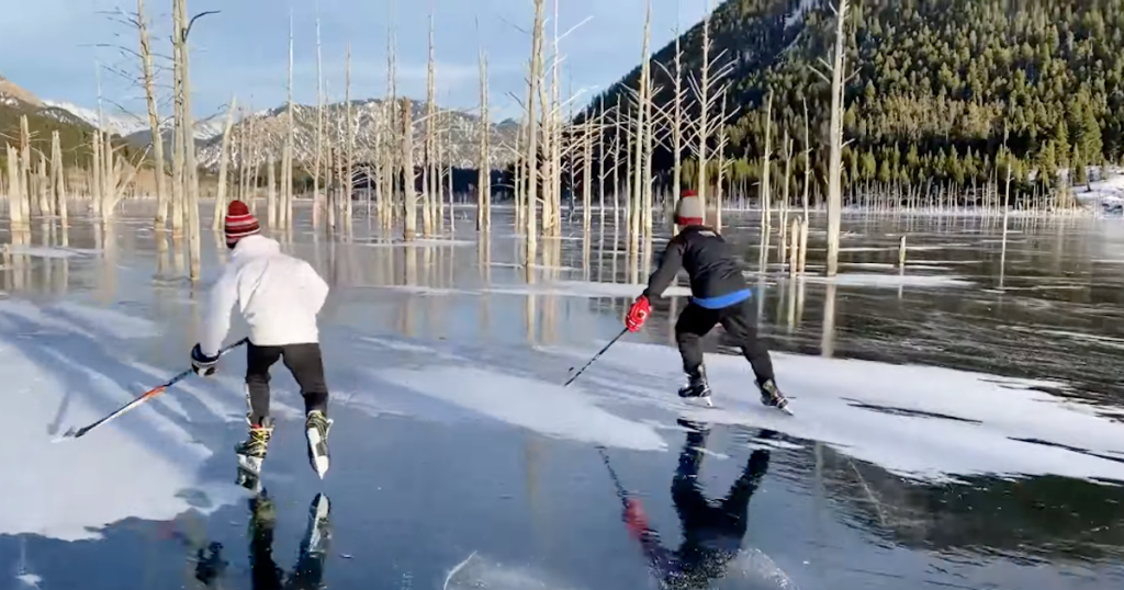Two Kids Play Hockey On Montana's Frozen Quake Lake