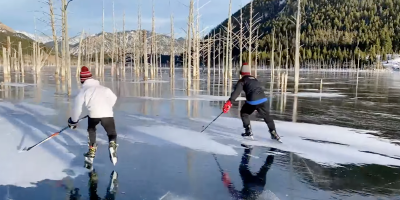 Two Kids Play Hockey On Montana's Frozen Quake Lake