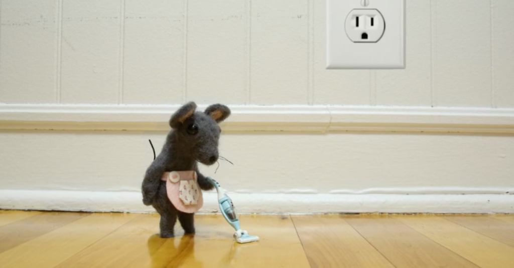 Stop-Motion Animation of a Felt Mouse Cleaning With a Tiny Felt Vacuum