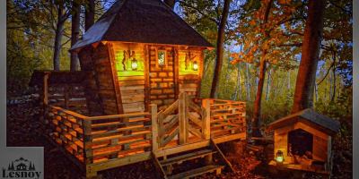 A Man Built a Little House in the Woods Out of Wooden Pallets