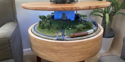 A “Close Encounters of the Third Kind” Table With a UFO Rising Top