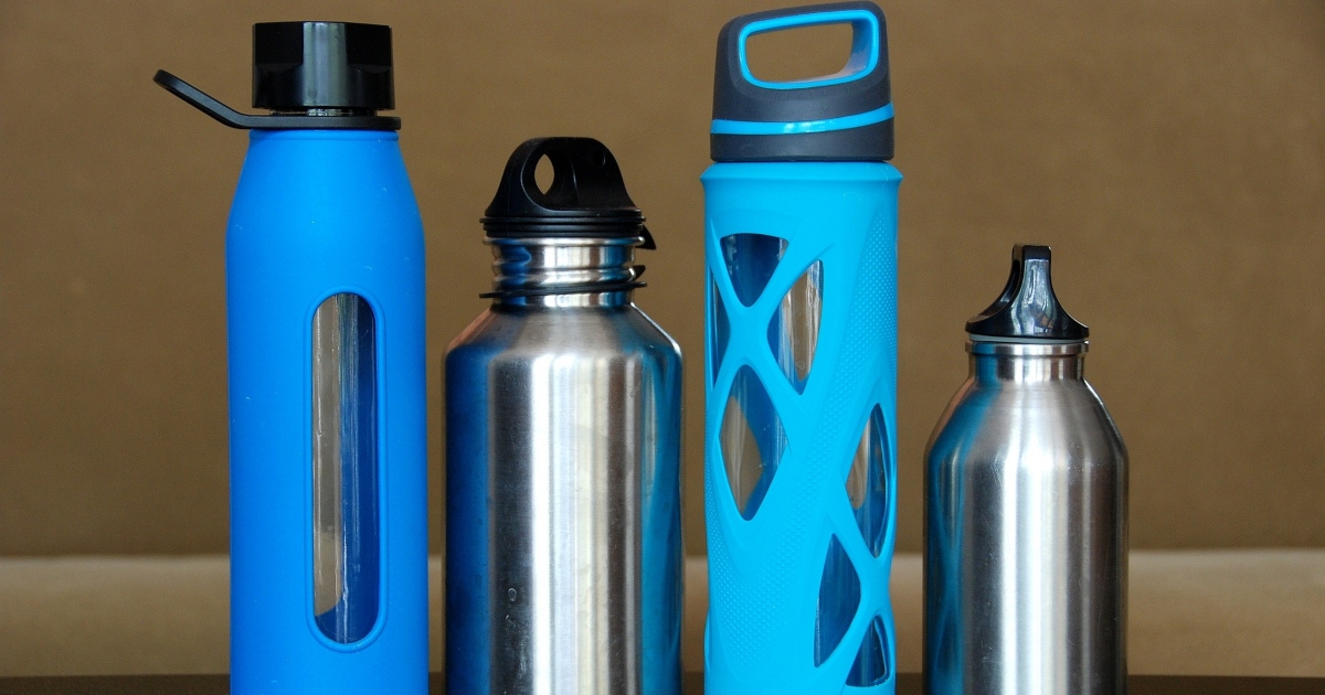 Four water bottles add meda How Do You Know if You’re Drinking Too Much or Not Enough Water?