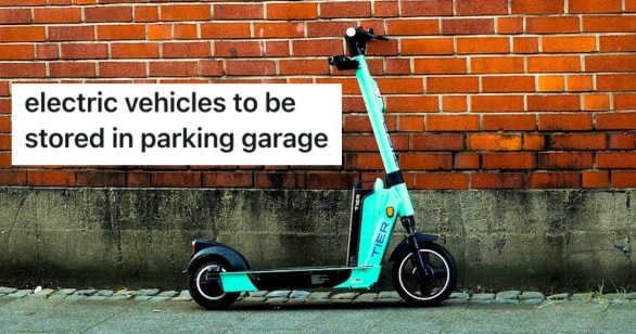 electric scooter sitting in front of a brick wall