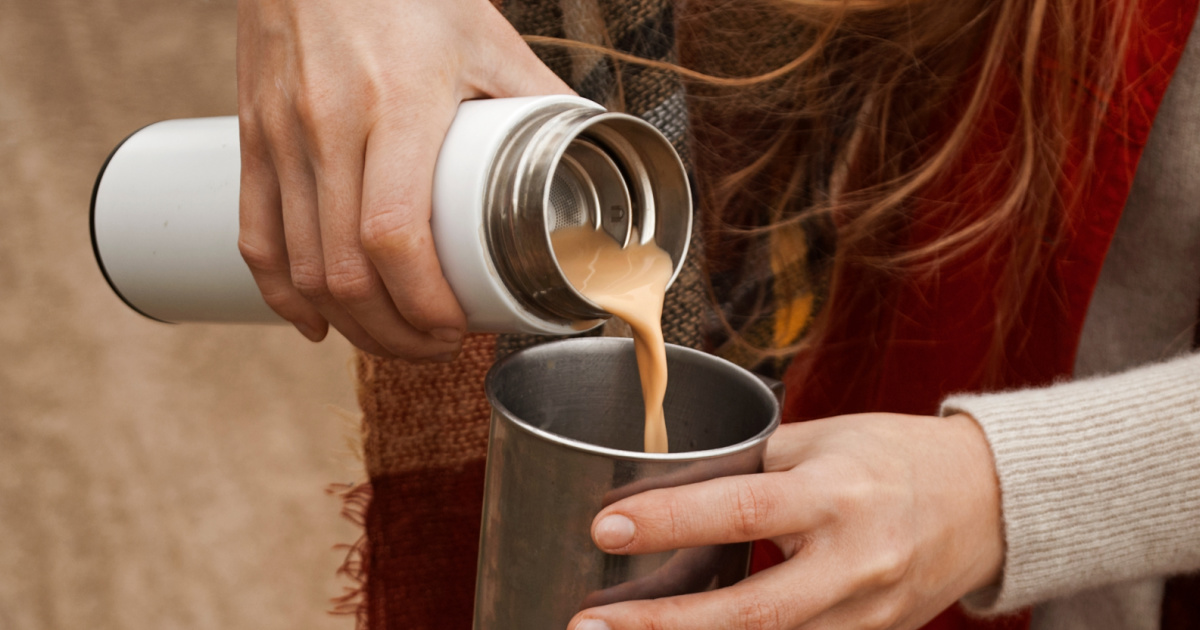 woman pouring coffee from thermos