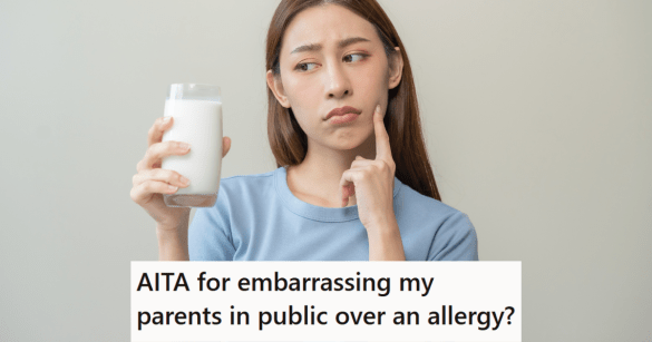 woman glaring at a glass of milk