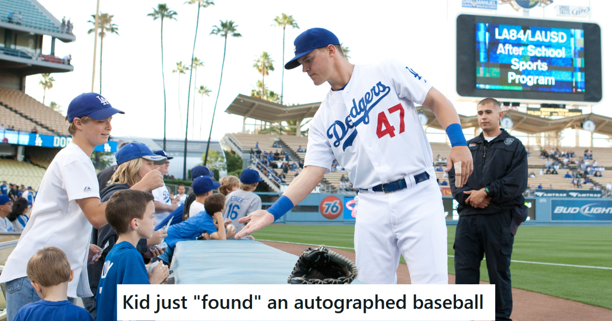 baseball player giving autographs to kids