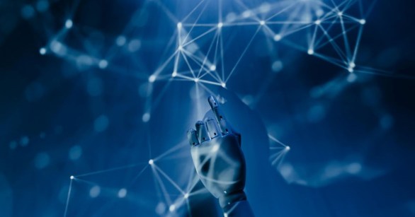 A robot hand amid beams of blue light