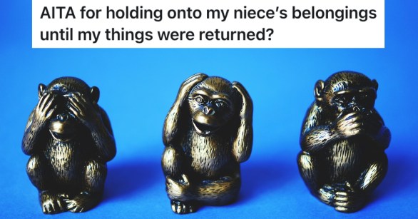 Three monkey figurines on a blue background