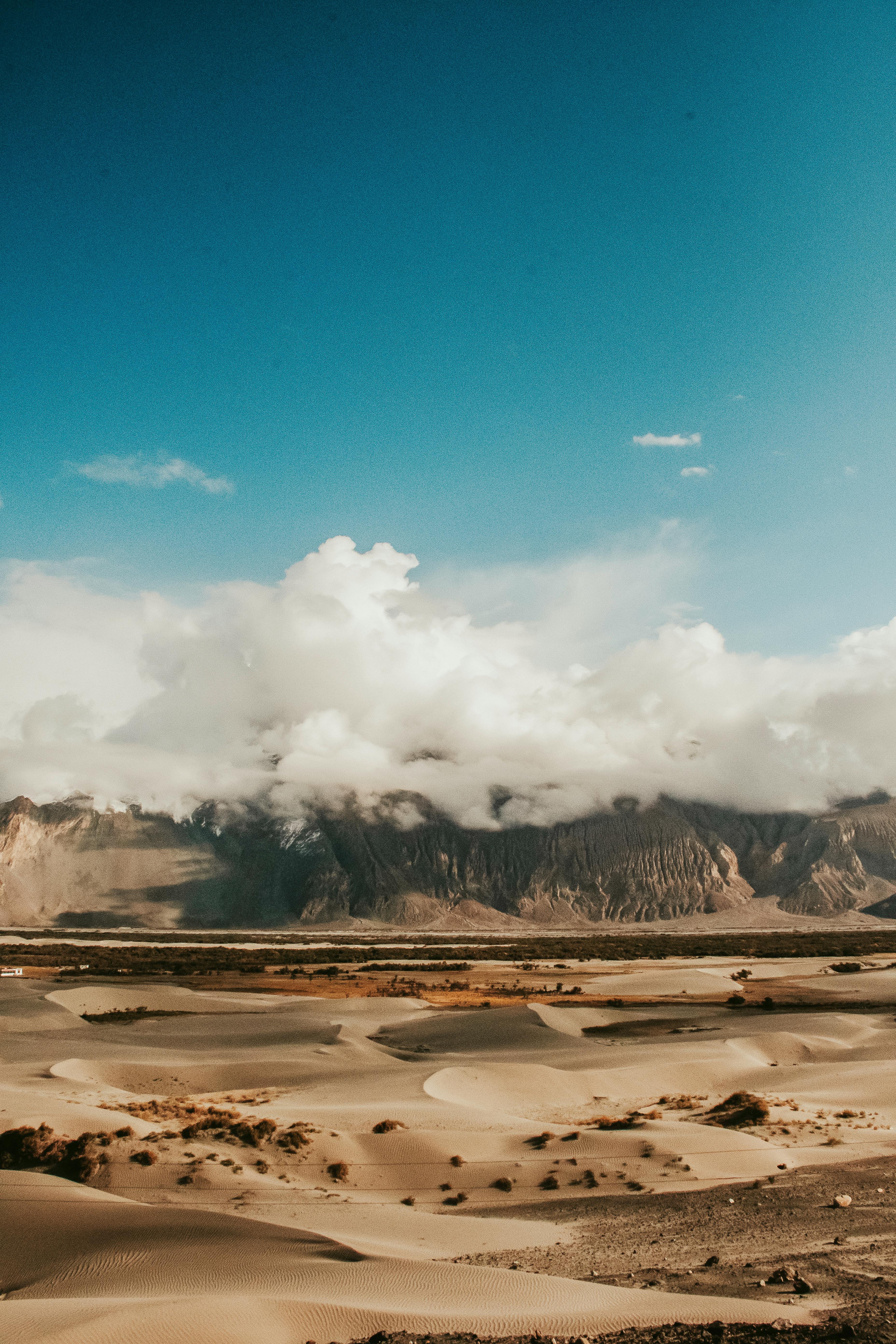 Sand dunes with fog above