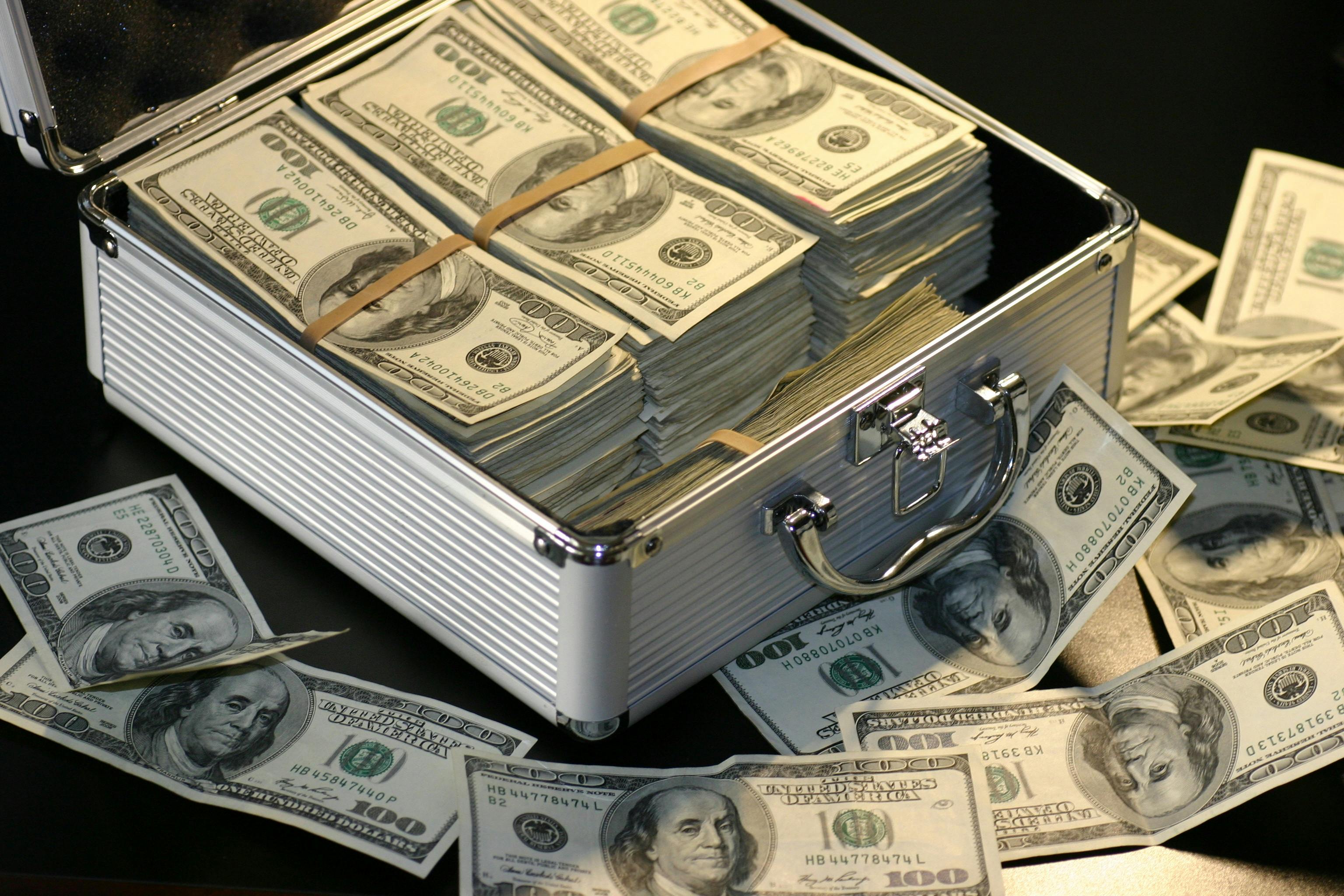 Briefcase packed with hundred dollar bills