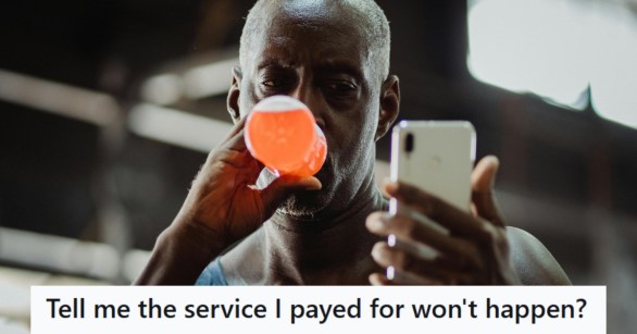 man on his phone at the gym