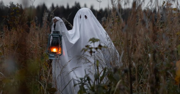A ghost in a field with a lantern