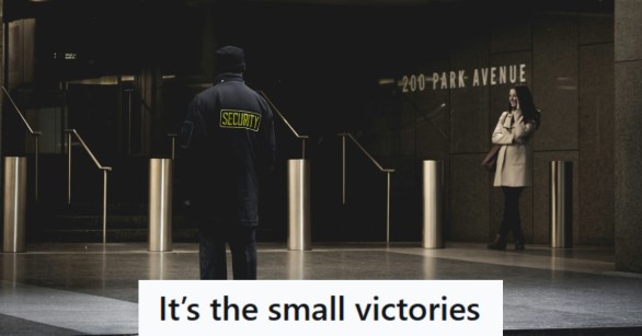 Security Guard walking in front of NYC building