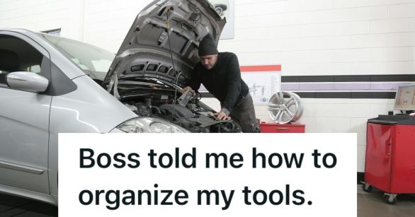 Mechanic working under the car hood