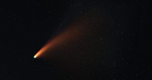 A meteor flying against a black sky