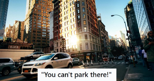 White SUV on busy street in the city