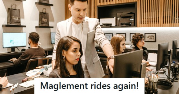 Manager showing woman how to use their computer system
