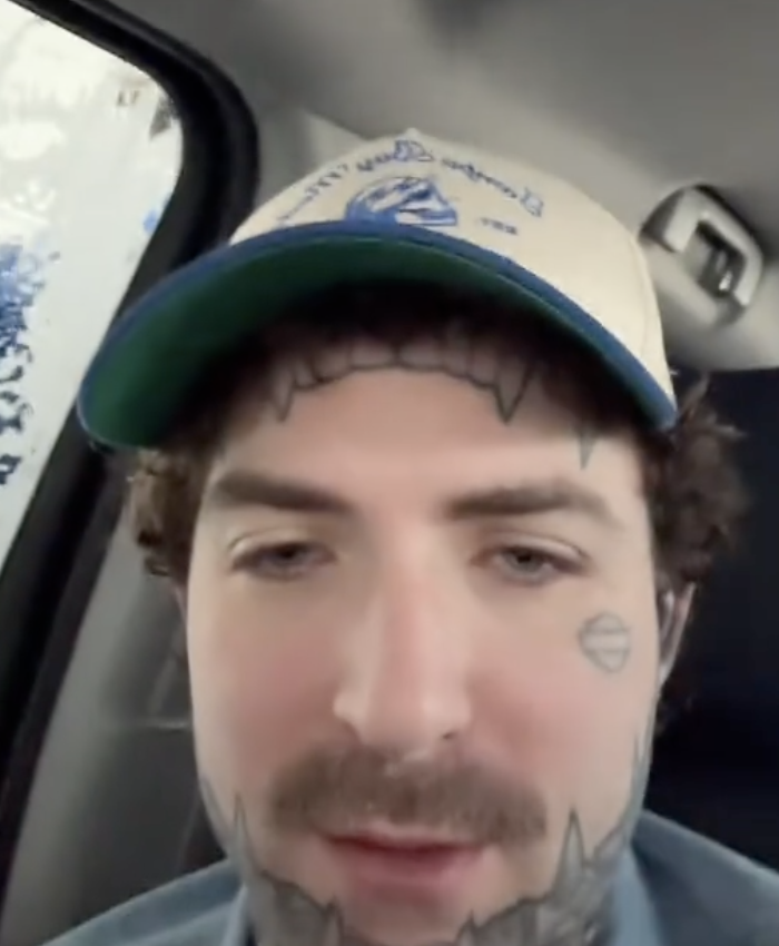 a man talks from inside a car wash