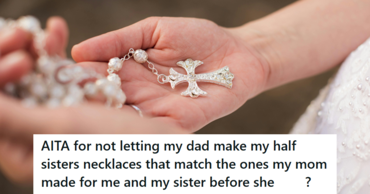 Woman holding a beautiful pearl necklace with cross