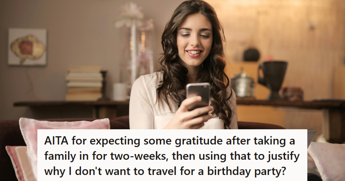 woman smiling looking at her phone