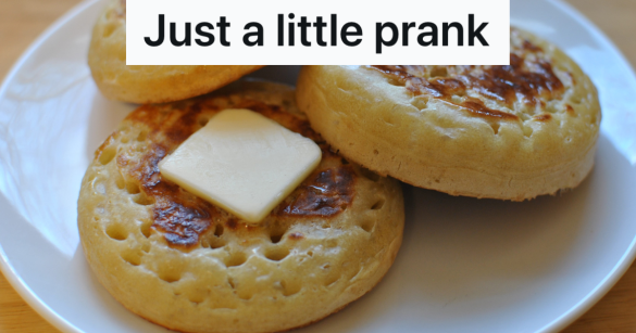 buttered crumpets on a white plate