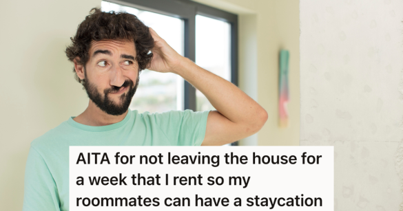 man in green t-shirt scratching his head