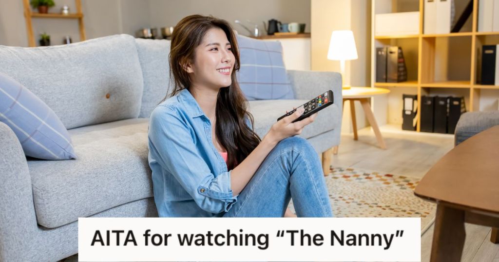 Woman happily watching TV while holding the remote control