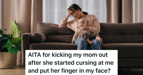 sad woman sits on couch holding baby