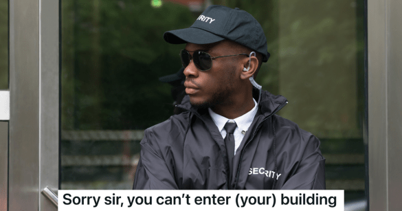 security guard stands outside door