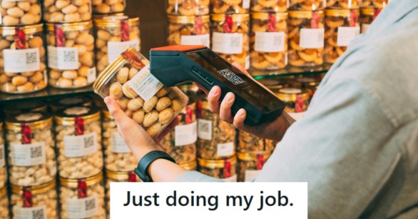 Retail worker scanning a product for pricing info