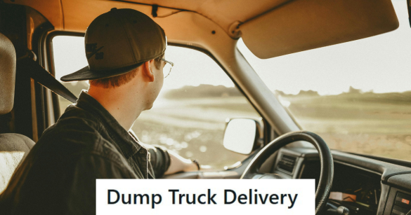 Man driving a truck in a black hat