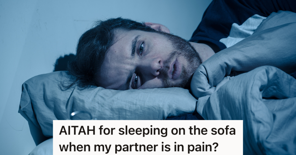 man lying awake in bed