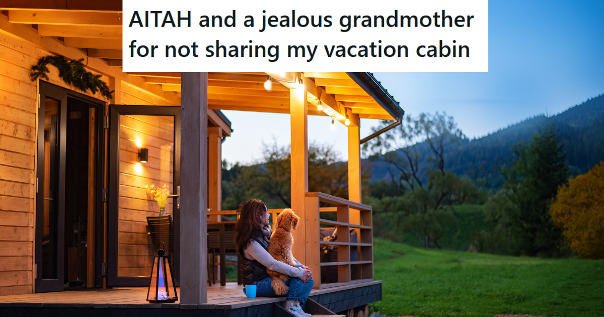 woman and dog sit on cabin porch at night