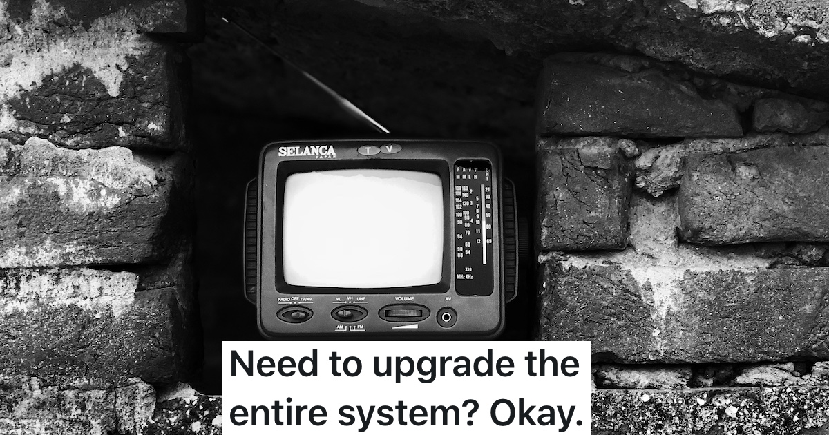 black and white picture of old TV with rabbit ear antenna