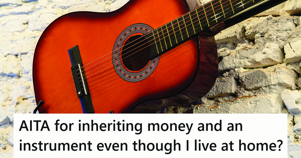 guitar against a stone wall