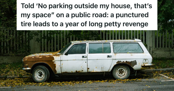 junk car parked in front of house