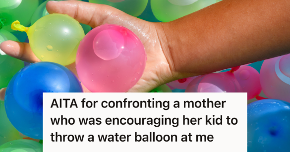 kid holding water balloons