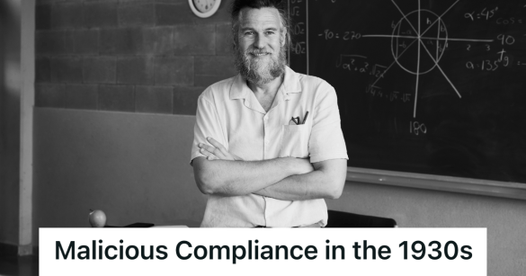 male teacher in front of a chalkboard