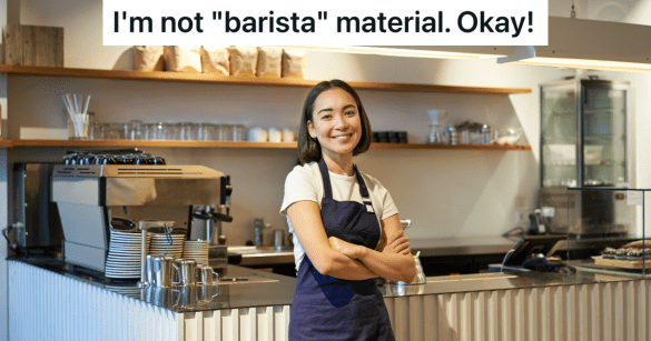 smiling barista with arms folded