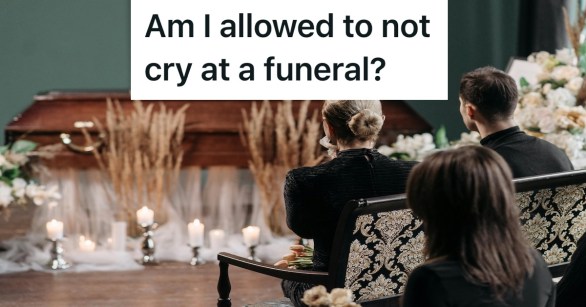 people grieving in front of a casket