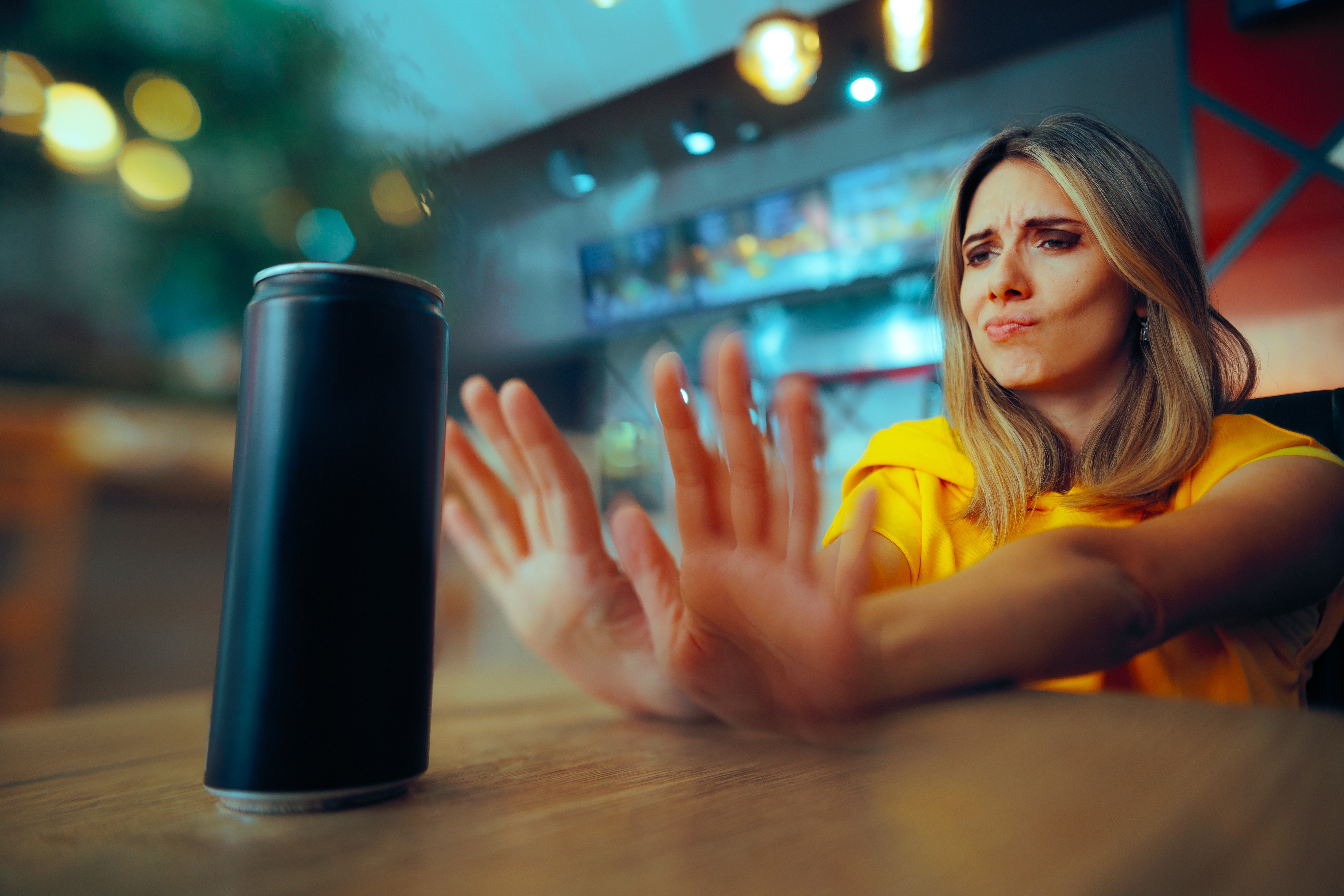 woman pushing away energy drink